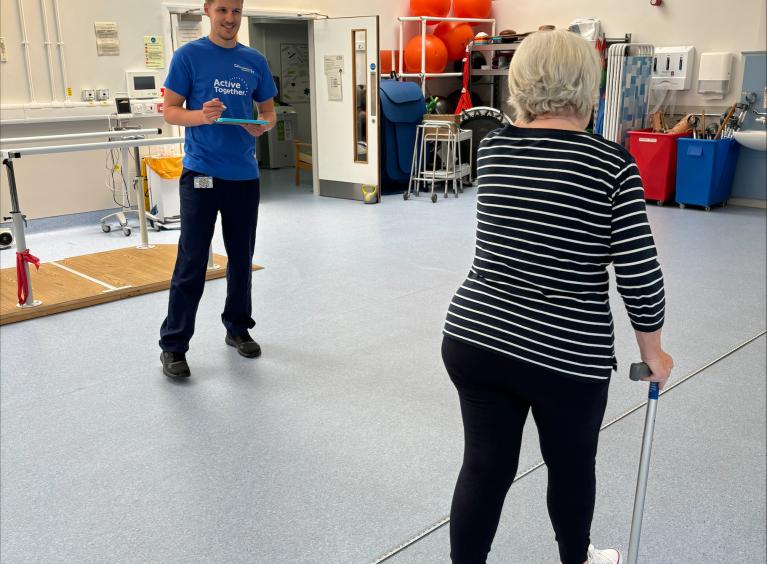 One staff member providing physiotherapy to a patient