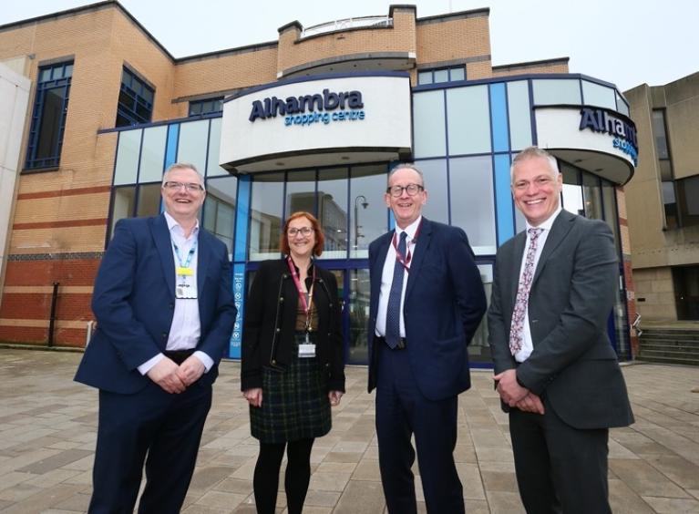 Four people stood in front of the Alhambra shopping centre in Barnsley