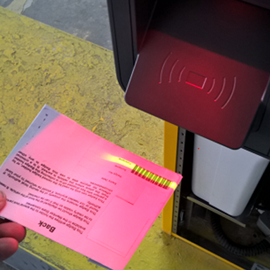 A person scans their Blue Badge whilst parking at the Hospital