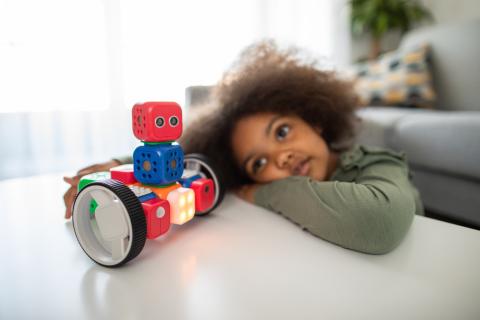 Girl playing with lego type blocks